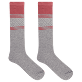 Gray knee-high socks with pink accents on a black background thumbnail