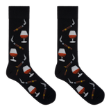 A pair of black crew socks with a repeating pattern of cognac whiskey glasses, cigars, and smoking pipes, displayed flat against a solid white background. thumbnail
