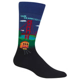 A single crew sock with a San Francisco theme, featuring a dark navy blue base with a colorful graphic of the Golden Gate Bridge, green hills, a red cable car, and the words 'SAN FRANCISCO' in light blue on the upper calf.