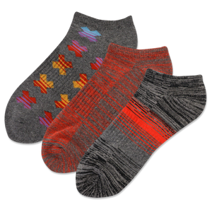 Three pairs of socks with different patterns on a white background