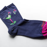 Navy blue socks with cocktail design and pink accents on a white background thumbnail