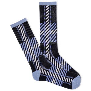 Pair of black, blue, and white patterned socks on a white background