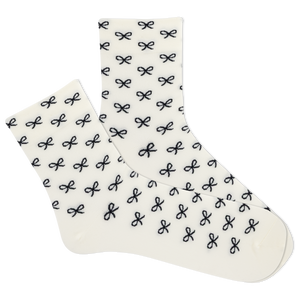 White women's socks with black bow pattern on a white background