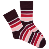 Pair of striped women's socks with red, pink, and brown colors on a white background