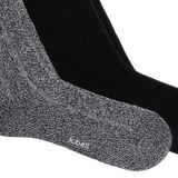 Two knit knee high socks from K-Belt, one in a heathered gray and white marled knit and one in solid black, shown overlapping on a white background. thumbnail