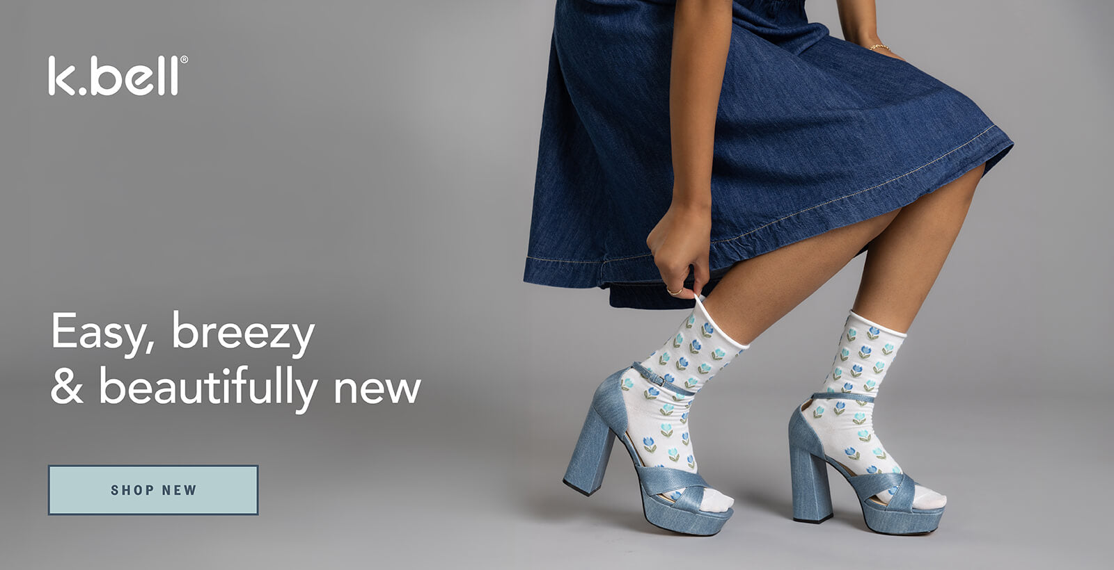 Woman wearing denim skirt and patterned socks with high heels, k.bell branding visible