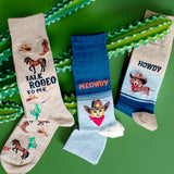 Assorted men's western-themed novelty HOTSOX crew socks with horses, cowboy hats, cats and dogs. thumbnail