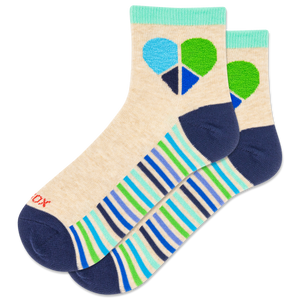 Colorful sock with geometric heart and stripe pattern on a beige background