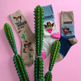 Women's novelty HOTSOX with western-themed prints, including horses, cowgirl hats, cats and dogs.