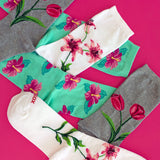 Sock scatter of three floral-themed women's HOTSOX.
