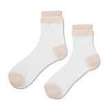 Pair of white socks with beige accents on a white background thumbnail