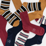 Collection of various patterned socks with a brand logo on a white background thumbnail