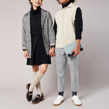 Two people wearing stylish outfits against a plain background thumbnail