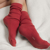 Red socks with a k.bell brand logo on a white textured surface thumbnail