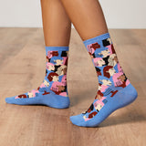 Colorful patterned socks on a wooden floor thumbnail